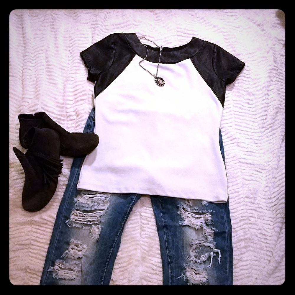 White top with faux leather sleeves and collar